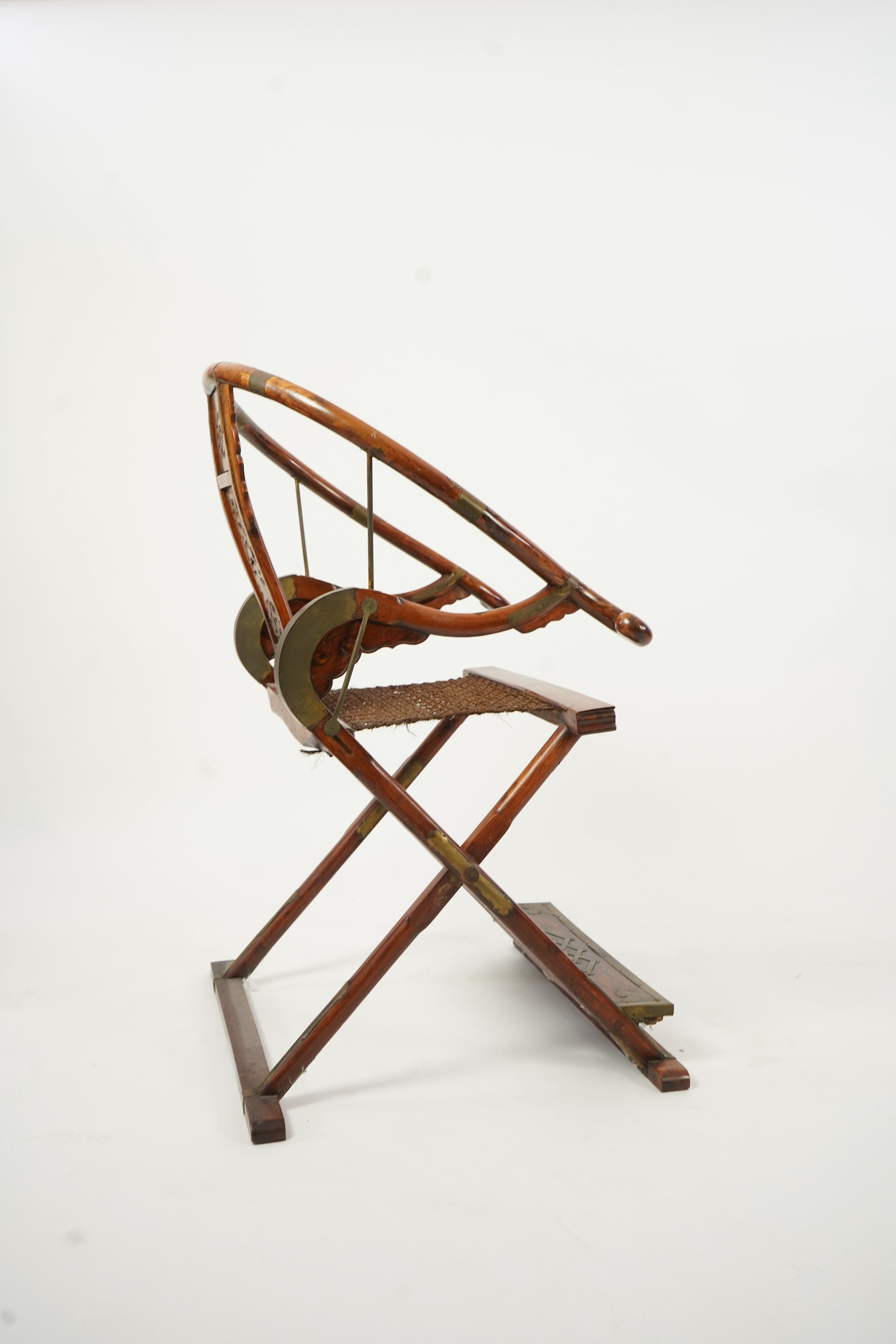 A Chinese huanghuali, hongmu and brass mounted folding hunting chair, jiaoyi, early 20th century